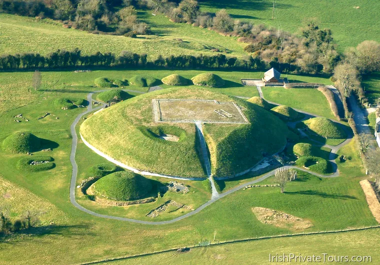 Aerial view of Knowth great mound with satellite tombs and paths in the Boyne Valley